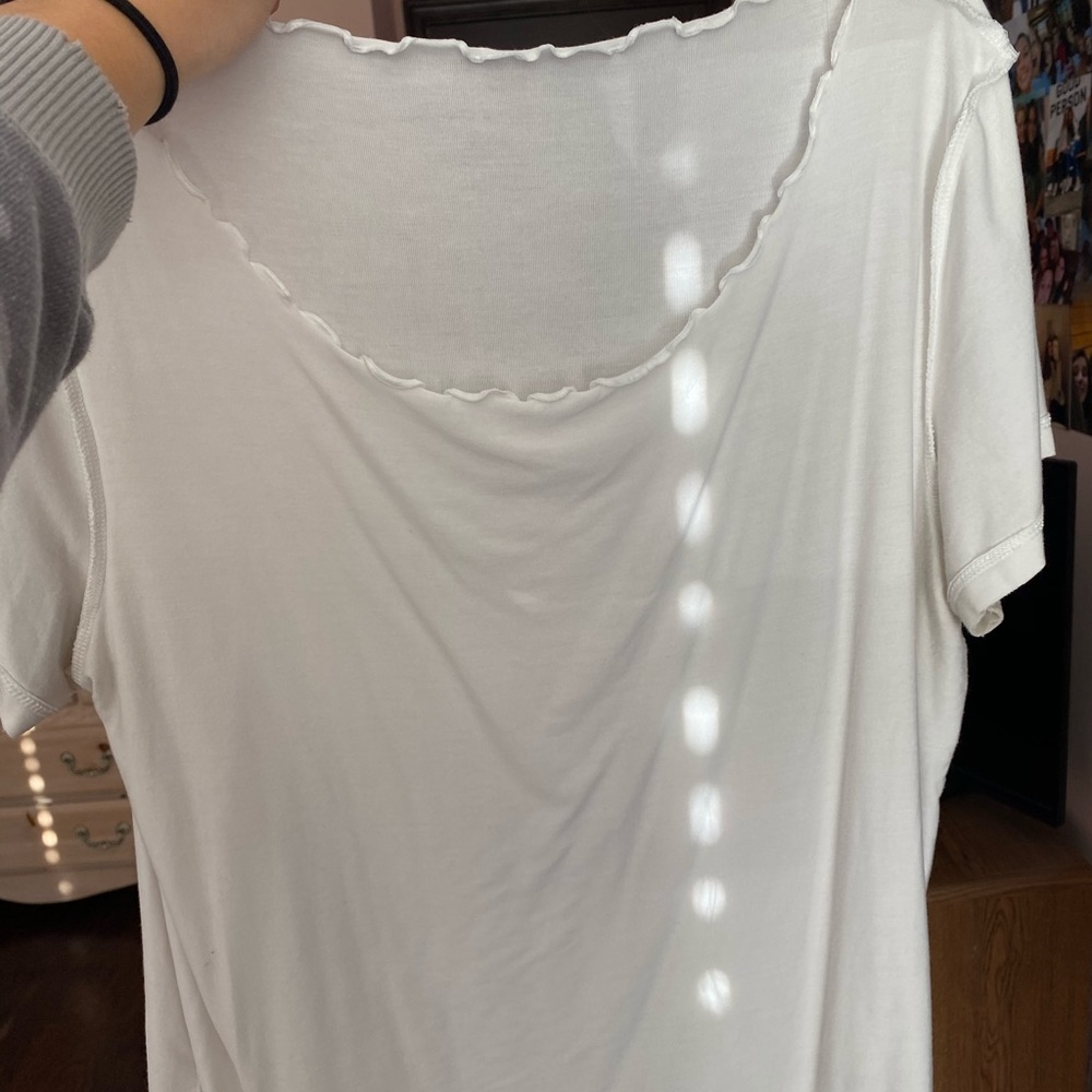 white ruffled tee